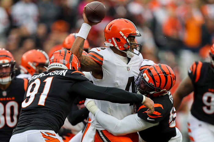 Dec 11, 2022; Cincinnati, Ohio, USA; Cleveland Browns quarterback Deshaun Watson (4) throws a pass against Cincinnati Bengals defensive end Trey Hendrickson (91) and defensive end Joseph Ossai (58) in the first half at Paycor Stadium. Mandatory Credit: Katie Stratman-USA TODAY Sports